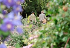 Visitors enjoying the Hidden Gardens of Bury