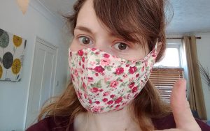Charlotte Macdonald wearing a face mask made in aid of the Hospice
