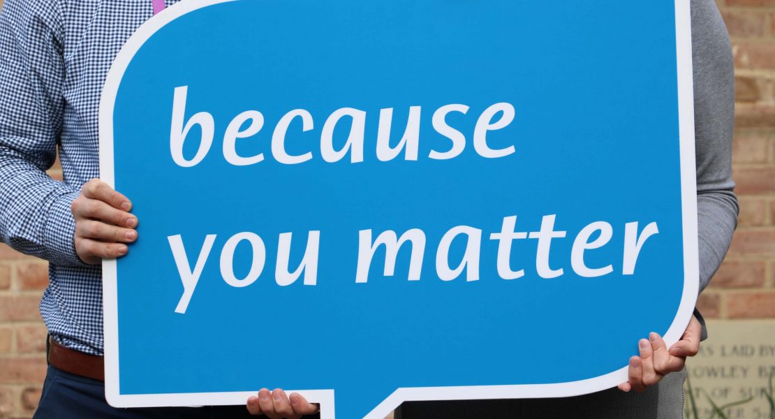 blue speech bubble sign saying 'because you matter'