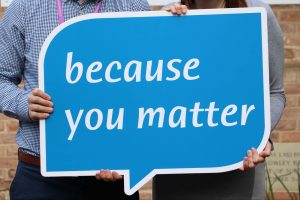 blue speech bubble sign saying 'because you matter'