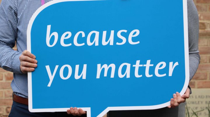 blue speech bubble sign saying 'because you matter'