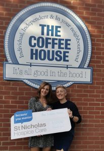 coffee house presenting the hospice with a cheque