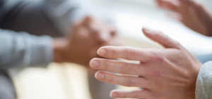 Close up of hands in a counselling session