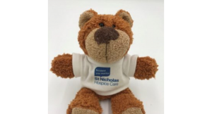 teddy wearing st nicholas hospice care t-shirt