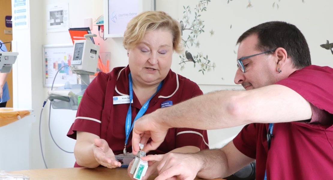 hospice staff looking at a syringe driver