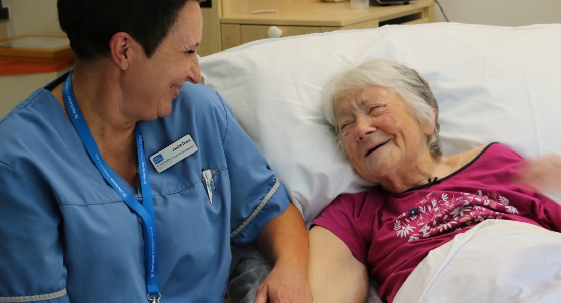 Image of Hospice Care Assistant and patient talking