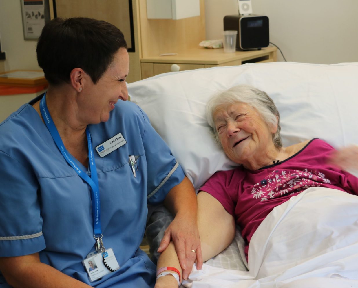 Image of Hospice Care Assistant and patient talking