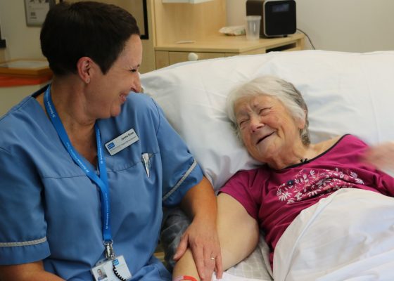 Image of Hospice Care Assistant and patient talking