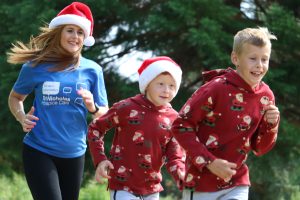 runners promoting the St Nic's Festive Fun Run dressed in festive clothing