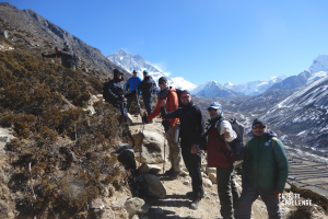 a group of charity supporters climbing a mountain
