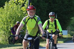 Smiling cyclist taking part in the St Nic's Cycle Ride