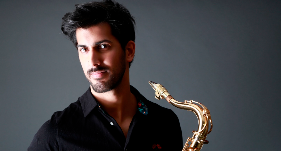 Headshot of Freddy de Lord with saxophone