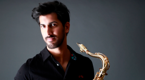Headshot of Freddy de Lord with saxophone