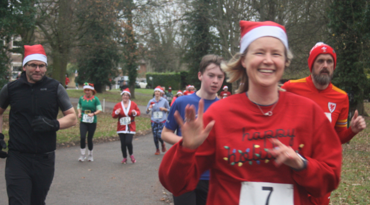 smiling runners wearing Christmas attire