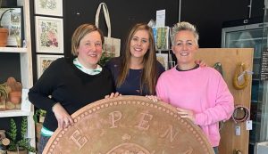 (left to right) Lucy Newell, Abby Mayes and Jessica Darnell celebrate after The Coffee House raises another £1,250 for St Nicholas Hospice Care