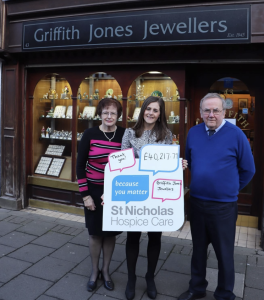 Griffin Jones Jewellers staff alongside Hospice Corporate Fundraiser holding a Hospice sign
