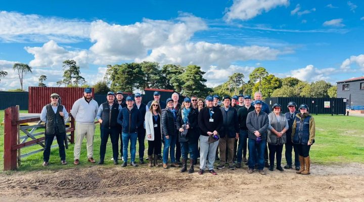 A corporate team wearing hard hats assembled for a Hospice fundraising event
