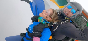 Tandem skydivers jumping out of plane